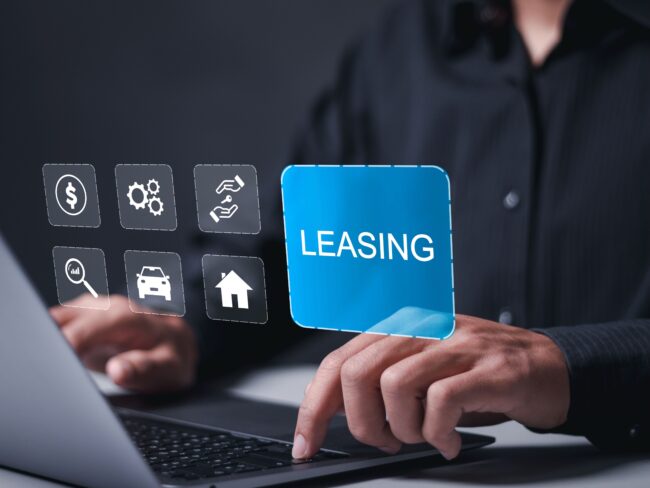 Leasing business concept. Businessman using laptop with leasing word and icons about contract agreement between lessee and lessor.